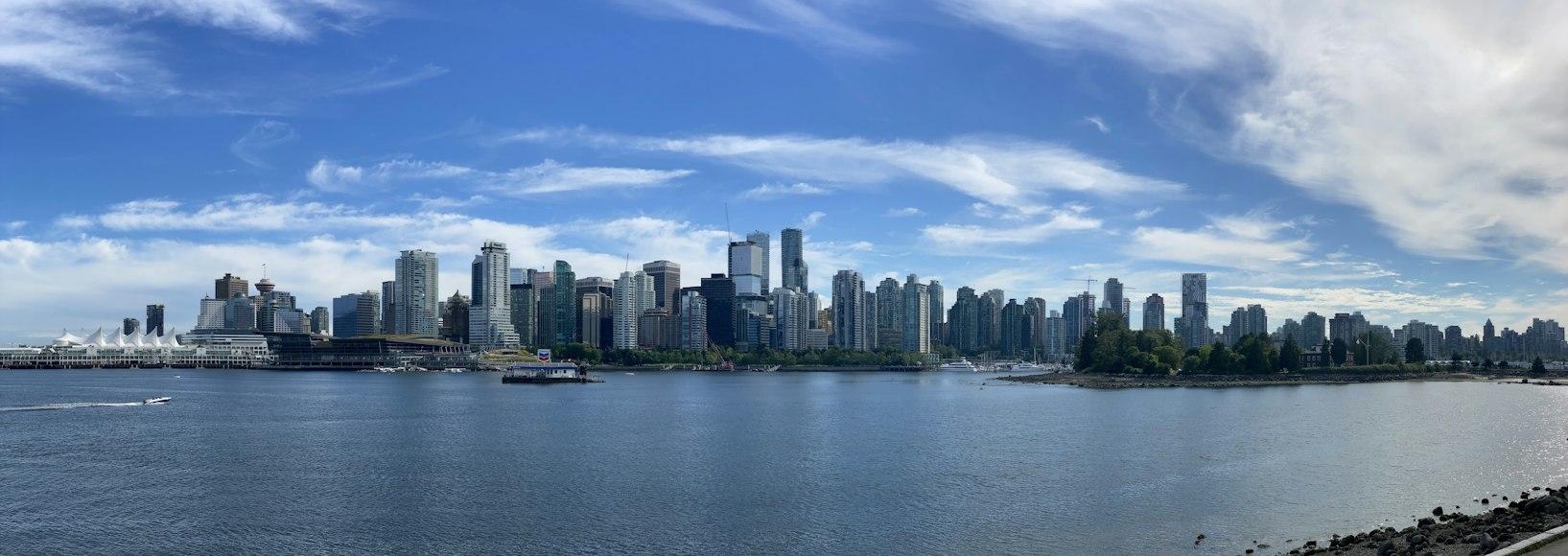 Downtown Vancouver skyline and Canada Place seen from Stanley Park across the harbour