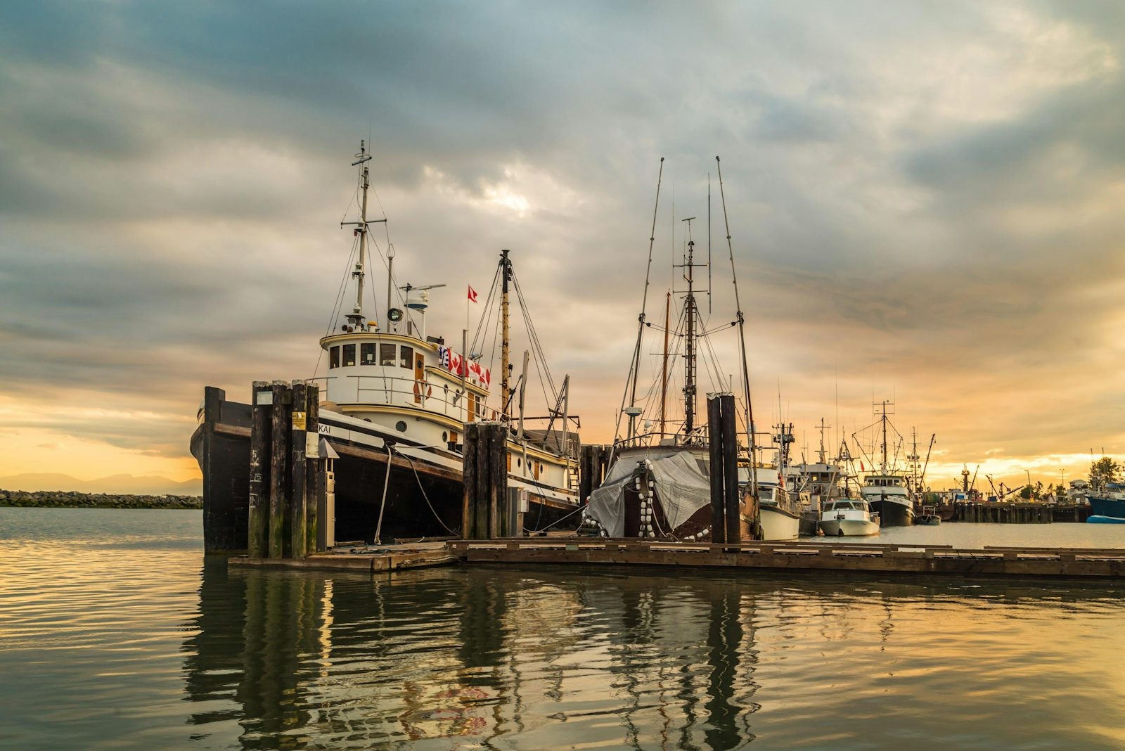 Fishing boats and reflections at sunset in Steveston Harbour, Richmond, British Columbia