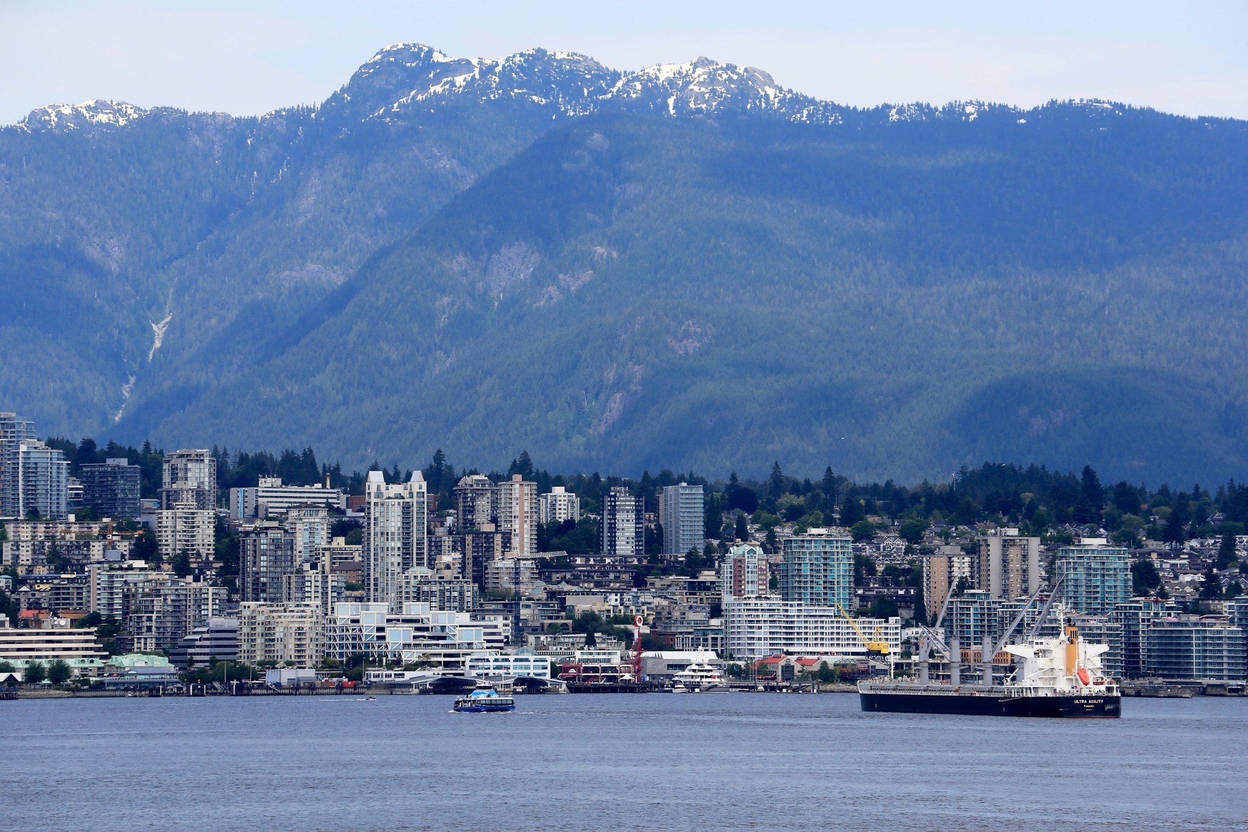 North Vancouver's waterfront below the forested North Shore mountains